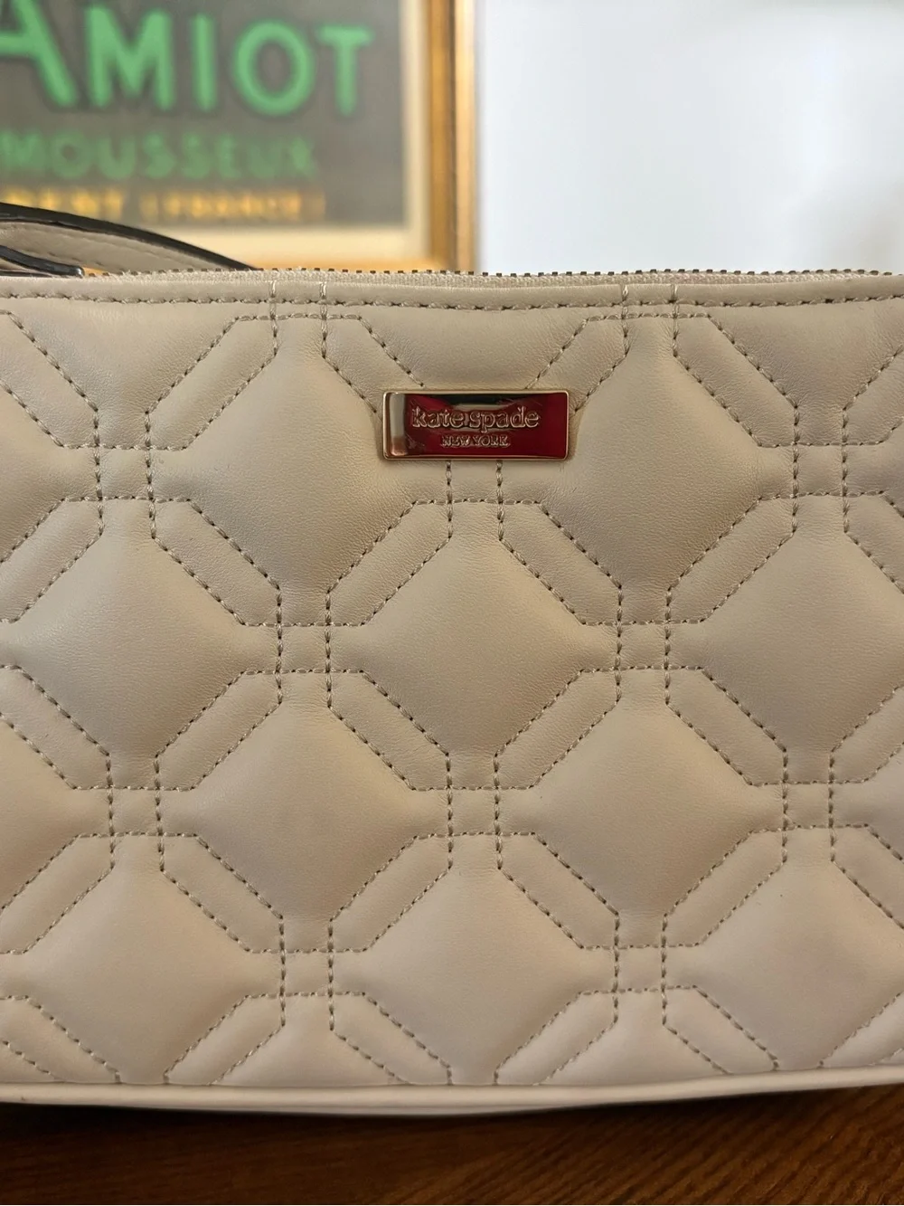 kate spade Cream Quilted Wristlet Clutch with Gold Logo